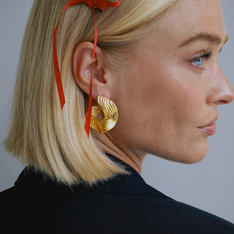 Boucles d'oreilles créoles swirl plaqué or