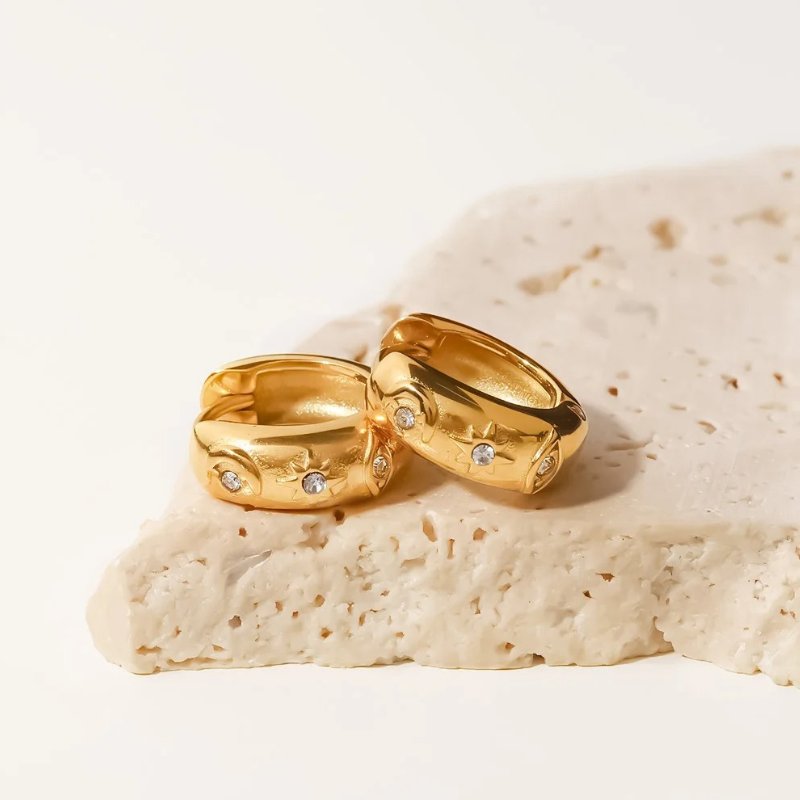 Boucles d'oreilles en zirconia plaqué or avec étoile et œil maléfique