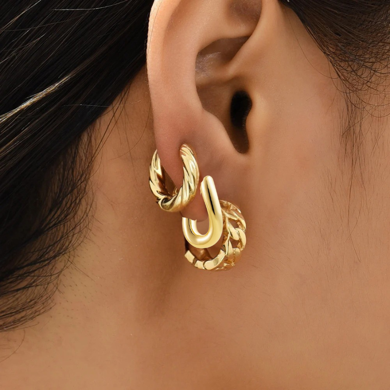 Boucles d'oreilles créoles torsadées plaqué or