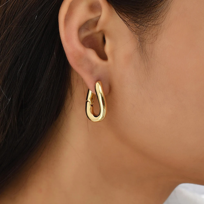 Boucles d'oreilles créoles torsadées plaqué or