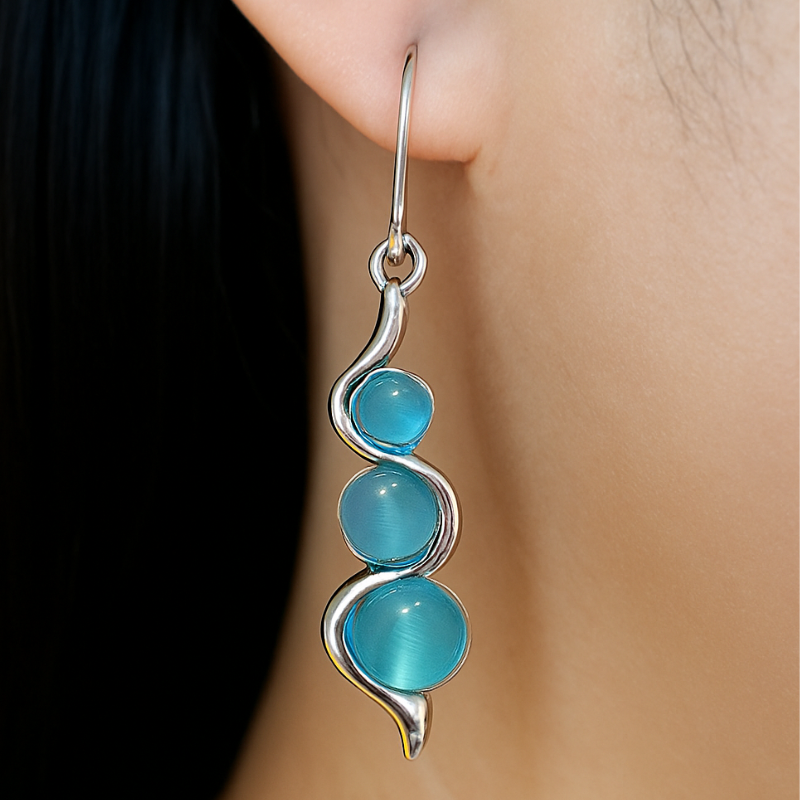 Boucles d'oreilles Pendantes en Forme de Vague avec Pierre Bleue