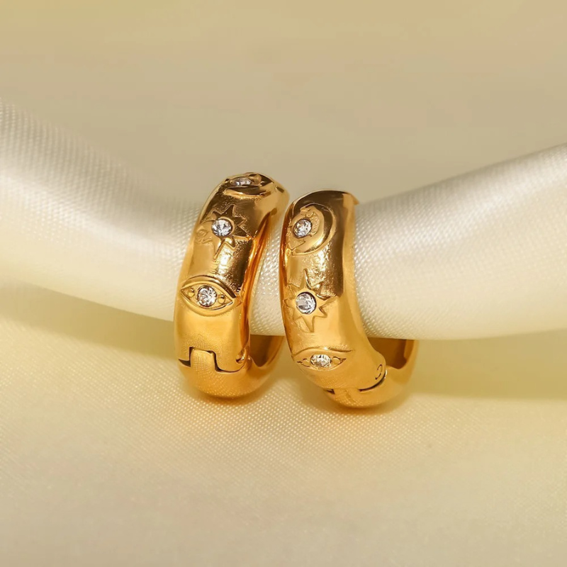 Boucles d'oreilles en zirconia plaqué or avec étoile et œil maléfique