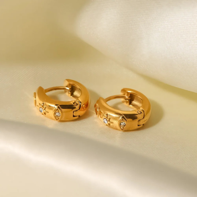 Boucles d'oreilles en zirconia plaqué or avec étoile et œil maléfique