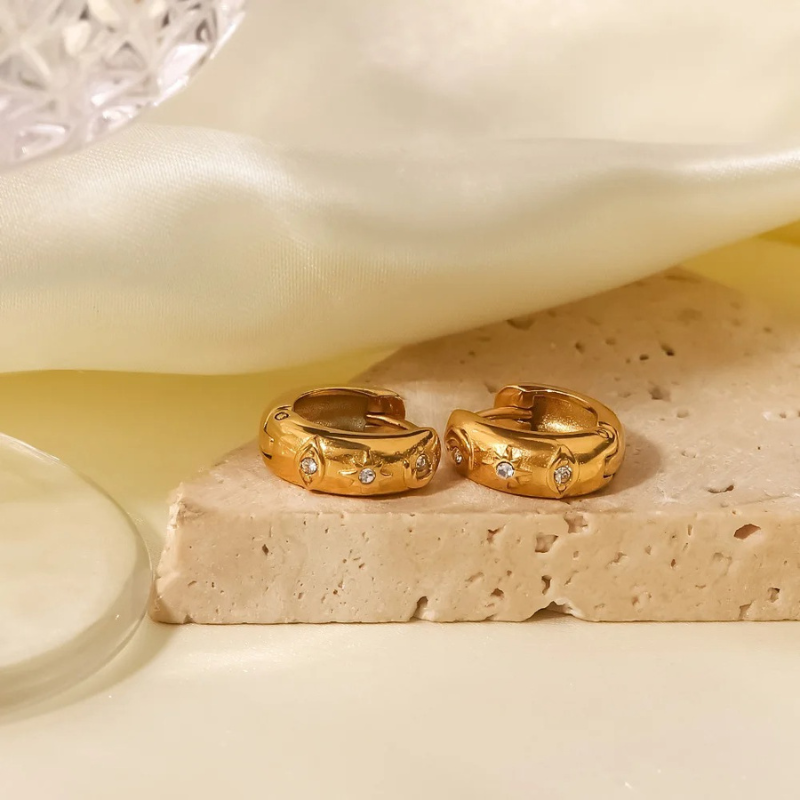 Boucles d'oreilles en zirconia plaqué or avec étoile et œil maléfique