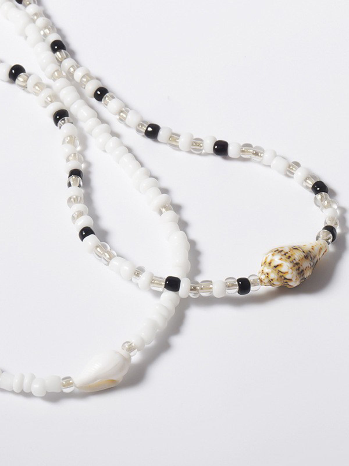 Collier choker perles blanches noires coquillages – Lila
