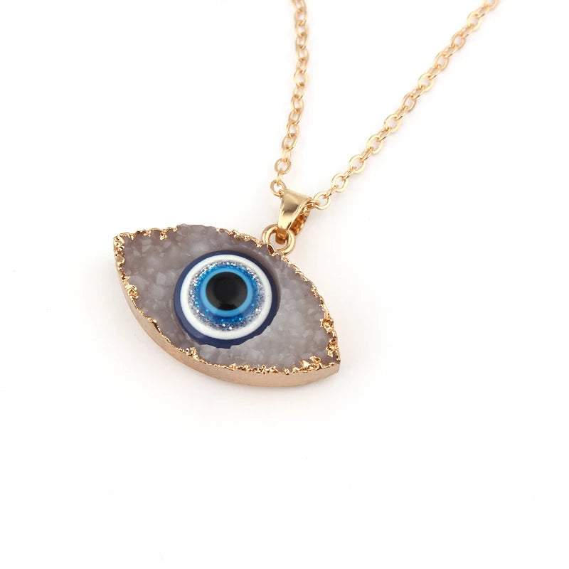 Pendentif navette or motif œil bleu blanc – Léo