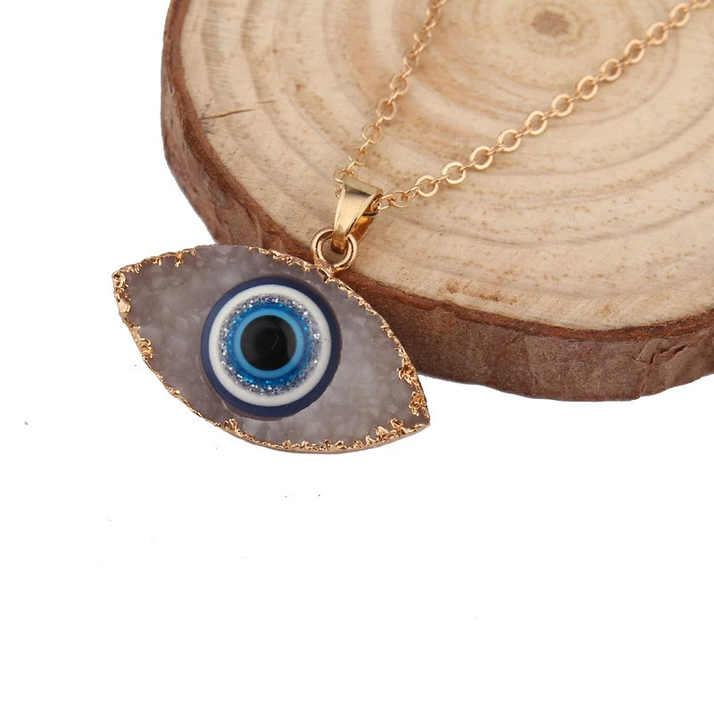 Pendentif navette or motif œil bleu blanc – Léo