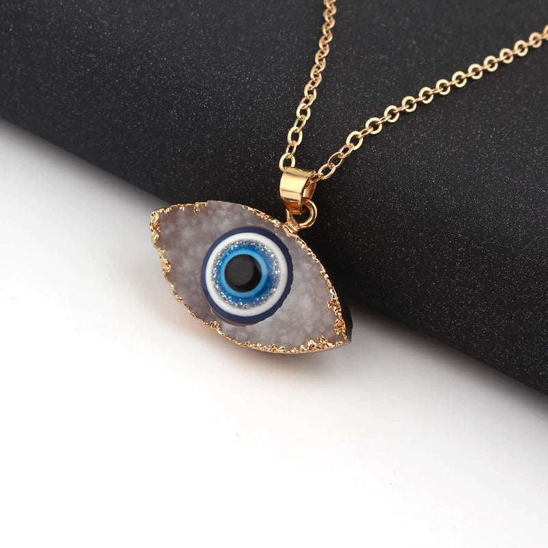 Pendentif navette or motif œil bleu blanc – Léo