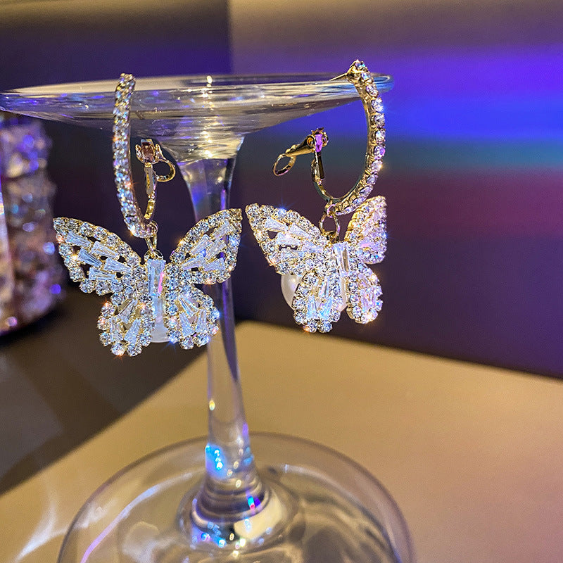 Boucles d’oreilles pendantes papillon or zircon – Lila