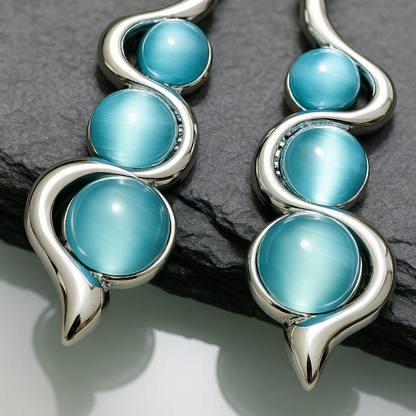 Boucles d'oreilles Pendantes en Forme de Vague avec Pierre Bleue