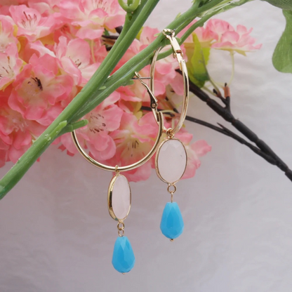 Boucles d'oreilles créoles dorées avec pierres colorées