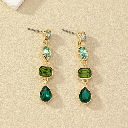 Boucles d'oreilles dorées avec cristaux verts plaqué or