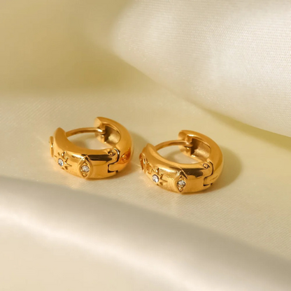 Boucles d'oreilles en zirconia plaqué or avec étoile et œil maléfique
