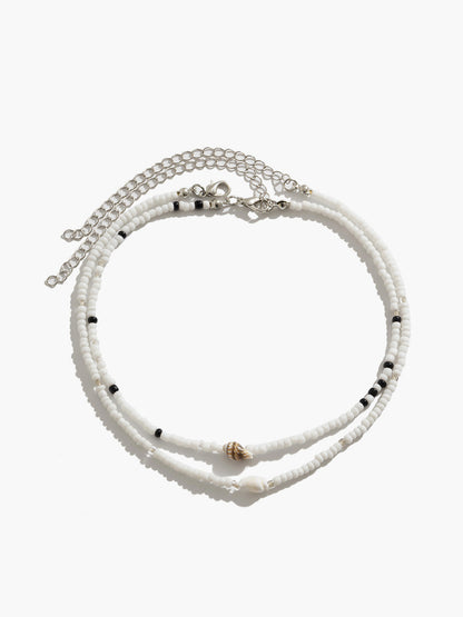 Collier choker perles blanches noires coquillages – Lila