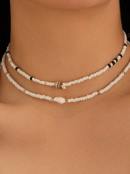Collier choker perles blanches noires coquillages – Lila