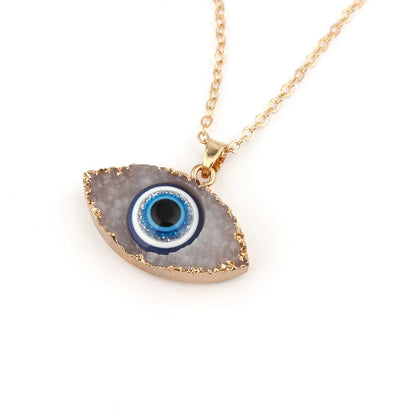 Pendentif navette or motif œil bleu blanc – Léo