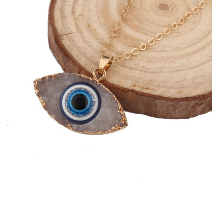 Pendentif navette or motif œil bleu blanc – Léo