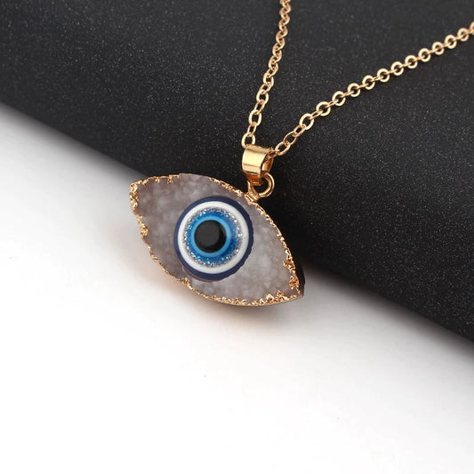 Pendentif navette or motif œil bleu blanc – Léo