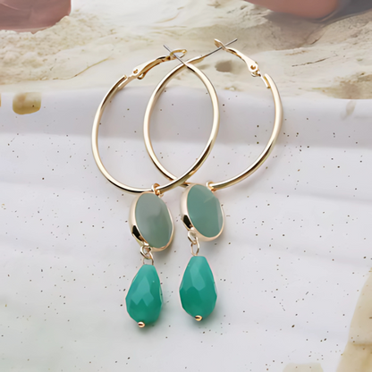 Boucles d'oreilles créoles dorées avec pierres colorées
