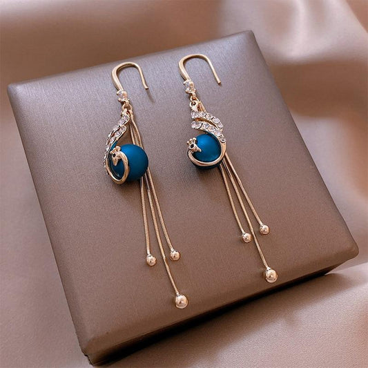 Boucles d’oreilles pendantes plaqué or perles bleues – Lila