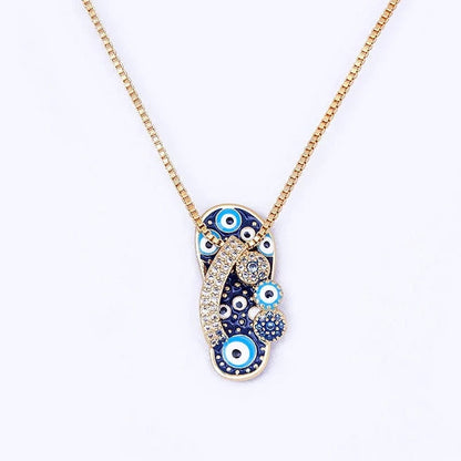 Pendentif tong or strass œil bleu – Léo