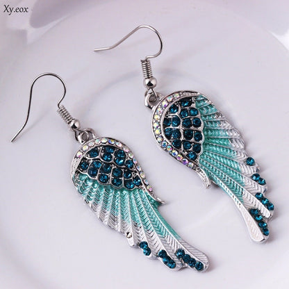Boucles d’oreilles pendantes ailes argenté turquoise – Lila