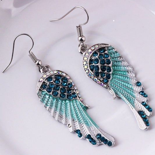 Boucles d’oreilles pendantes ailes strass bleu – Lila