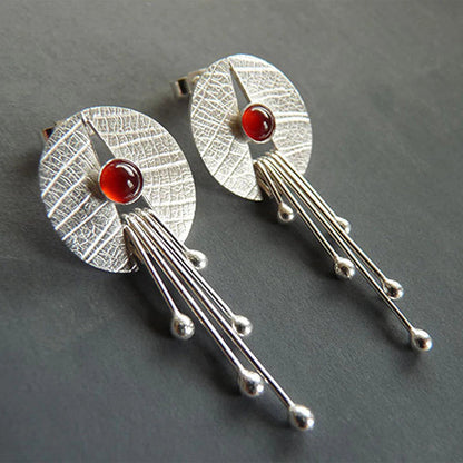 Boucles d’oreilles pendantes ajourées argent pierre rouge – Lise