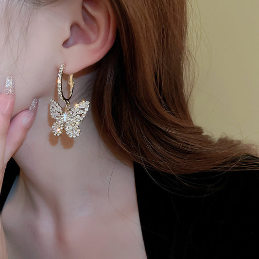 Boucles d’oreilles pendantes papillon or zircon – Lila