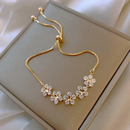 Bracelet or motifs floraux cristaux – Lila